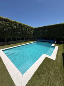 a swimming pool in the middle of a yard at Millwater Retreat in Silverdale