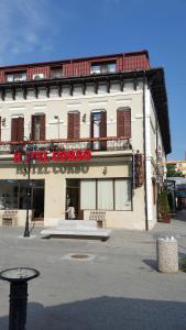 a building with a sign on the front of it at Hotel Corso in Buzău