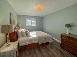 a bedroom with a bed and a dresser and a window at The Garden Gate in R Corner +14 photos