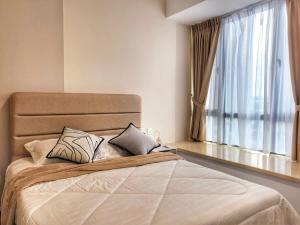 Ένα ή περισσότερα κρεβάτια σε δωμάτιο στο R&F Princess Cove 2BR Singapore CIQ Malls Nearby