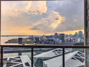 a view of the city from the balcony of a building at R&F Princess Cove 2BR Sea View JB CIQ Spacious in Johor Bahru