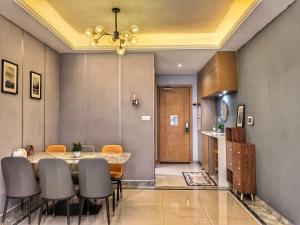 a dining room with a table and chairs at R&F Princess Cove 3BR CozyDesign JB Central CIQ in Johor Bahru