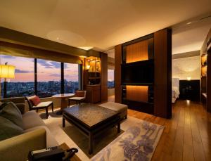 a living room with a couch and a table at Hyatt Regency Naha, Okinawa in Naha