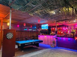 a room with a pool table and a bar at Tam Coc Big J hostel in Vũ Lâm