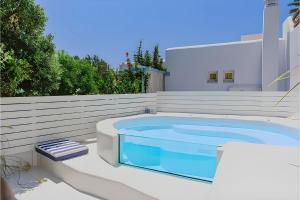 a swimming pool in the backyard of a house at Philia Villas in Agkidia