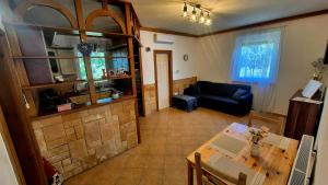 a living room with a couch and a table at GSH Apartman 1 in Debrecen