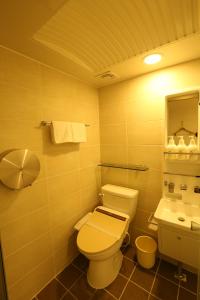 a bathroom with a toilet and a sink at Tripstay Myeongdong in Seoul