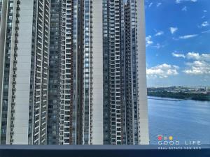 a large tall building next to a body of water at Queen Room R&F Princess Cove Shared Common Space in Johor Bahru +20 photos
