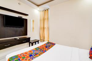 Ένα ή περισσότερα κρεβάτια σε δωμάτιο στο Via Royal Regalia Inn