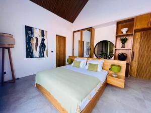 Ένα ή περισσότερα κρεβάτια σε δωμάτιο στο Villa Putri Berawa