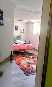 a room with two beds and a rug at CrazyRoom in Schladming