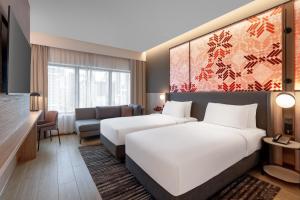 Postel nebo postele na pokoji v ubytování Grand Mercure Kuala Lumpur Bukit Bintang + 21 fotografií