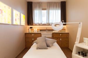 A bed or beds in a room at Hotel Heubad