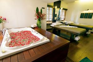 a large bath tub filled with red peppers on a table at The Elements Krabi Resort - SHA Plus in Klong Muang Beach