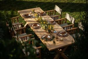 a wooden table with plates of food on it at Dali Heartland Castle VILLA Cliffside Sea View Estate in Dali