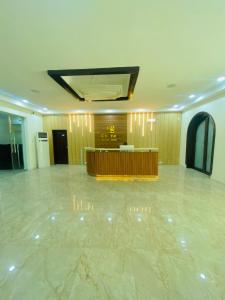 a large room with a lobby with a table in it at Chateux de atlantique Hotel in Lagos
