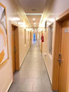 a hallway of an office building with a long corridor at Chateux de atlantique Hotel in Lagos