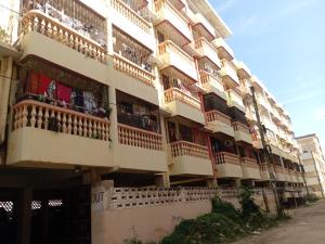 a building with balconies on the side of it at Amore Cosy 2 Bedroom Apartment in Mombasa