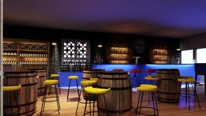 een bar met houten krukken en een blauwe toonbank bij Papagei Cosy Home in Staßfurt