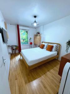 Ένα ή περισσότερα κρεβάτια σε δωμάτιο στο Passion et détente by UTA HOUSE +34 φωτογραφίες