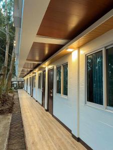 an empty hallway of a building with windows at Esprutingkle Business Hotel Kidapawan in Kidapawan