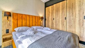 Postel nebo postele na pokoji v ubytování Złoty Horyzont, Sun & Snow + 1 fotografie