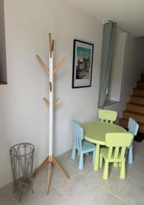 a dining room with a table and chairs at Le Pressoir Macy - Terracobois in Choussy +39 photos