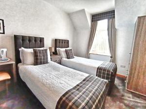 Postel nebo postele na pokoji v ubytování By The Bay