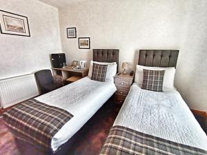 Postel nebo postele na pokoji v ubytování By The Bay