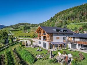 an aerial view of a house in a vineyard at Steindlgut - Weinberg Chalets in Brixen