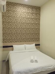 Krevet ili kreveti u jedinici u objektu Hotel Alor Gajah