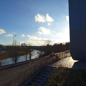 a view of a river next to a bridge at VilniusCentralSpot in Vilnius
