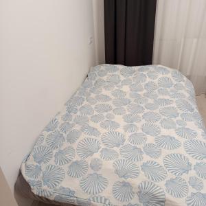 a bed in a room with a bedspread on it at VilniusCentralSpot in Vilnius