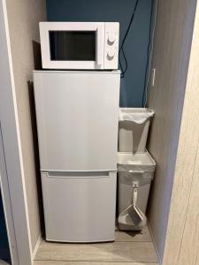 Η κουζίνα ή μικρή κουζίνα στο 最大4名宿泊 名古屋駅近 地下鉄徒歩5分 お部屋貸し切り 無料Wi-Fi