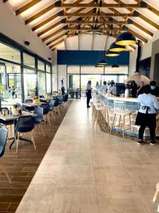 a restaurant with chairs and tables and a bar at Ballito Hills Lifestyle Estate in Ballito