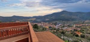a view of a town with mountains in the background at Hotel Rural Atalaya in Guadalupe