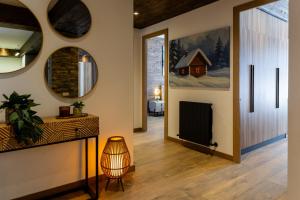 a living room with a fireplace and a television at New Gudauri Ski4Life in Gudauri
