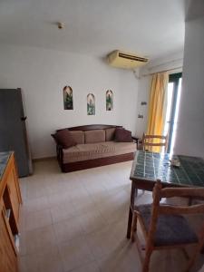 a living room with a couch and a table at Criss Naama bay in Sharm El Sheikh