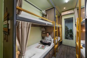 Postel nebo postele na pokoji v ubytování Hanoi EcoStay 2 hostel