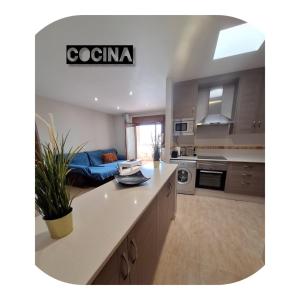 Kuchyň nebo kuchyňský kout v ubytování Apartamento nuevo en pleno centro. + 4 fotografie