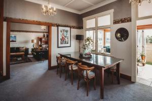 a dining room with a table and chairs at Timata Ora - 7BR family home in prime location in New Plymouth