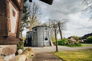 an image of a house with a silo at Ferienhaus Getreidesilo in Schneverdingen +12 photos