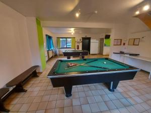 a room with two pool tables in a room at Gîte du sanglier in Durbuy