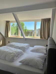 Postel nebo postele na pokoji v ubytování Groepsaccommodatie De Landerij