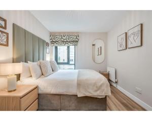 Ένα ή περισσότερα κρεβάτια σε δωμάτιο στο Central Belfast Apartments: Citygate