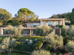 a house with a garden in front of it at BRIGHTLINE VILLA 8, Emma Villas in Asproli