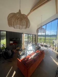 a living room with a couch and a table at Villa 7 in Martillac