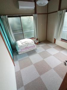 Postel nebo postele na pokoji v ubytování Nedokoro Minamihama Kujukuri - Vacation STAY 15881v + 21 fotografií