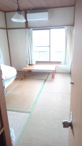 Postel nebo postele na pokoji v ubytování Nedokoro Minamihama Kujukuri - Vacation STAY 15881v