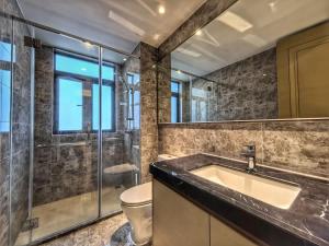 a bathroom with a sink and a toilet and a shower at R&F Princess Cove 2BR Sea View JB-SG Spacious in Johor Bahru